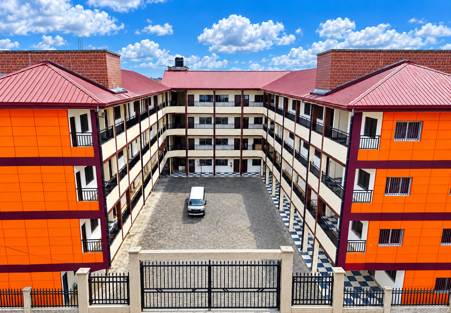 The school courtyard and classroom buildings