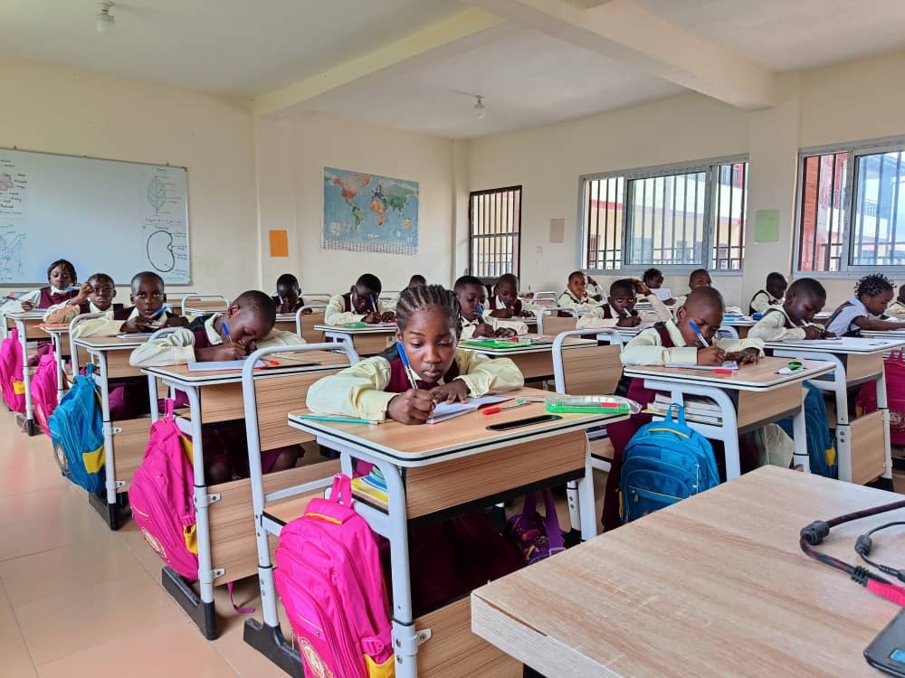 Innovative pupils working in a bright classroom
