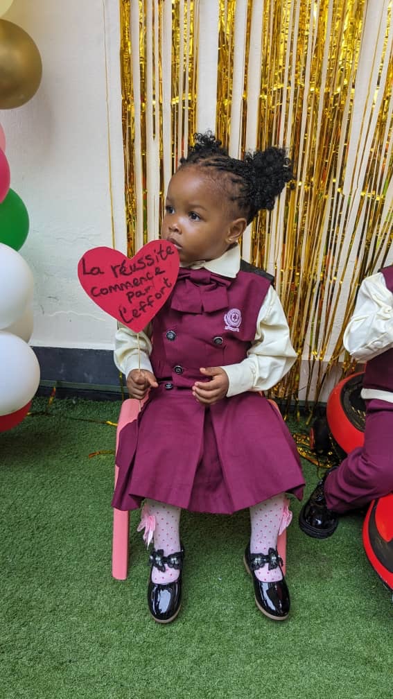 Young pupil in official uniform at the first day celebration
