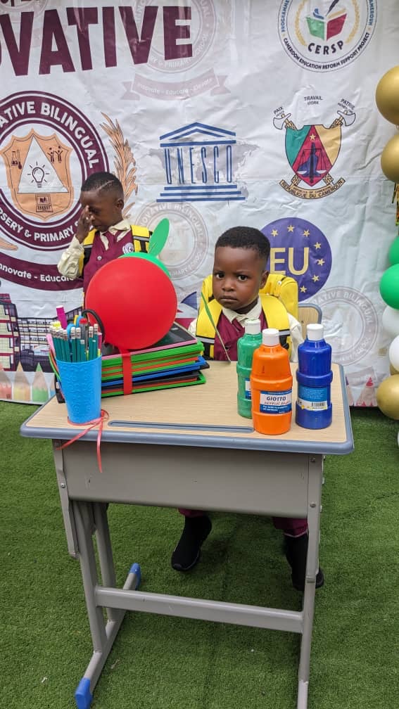 Pupil at a desk with school supplies on the first day