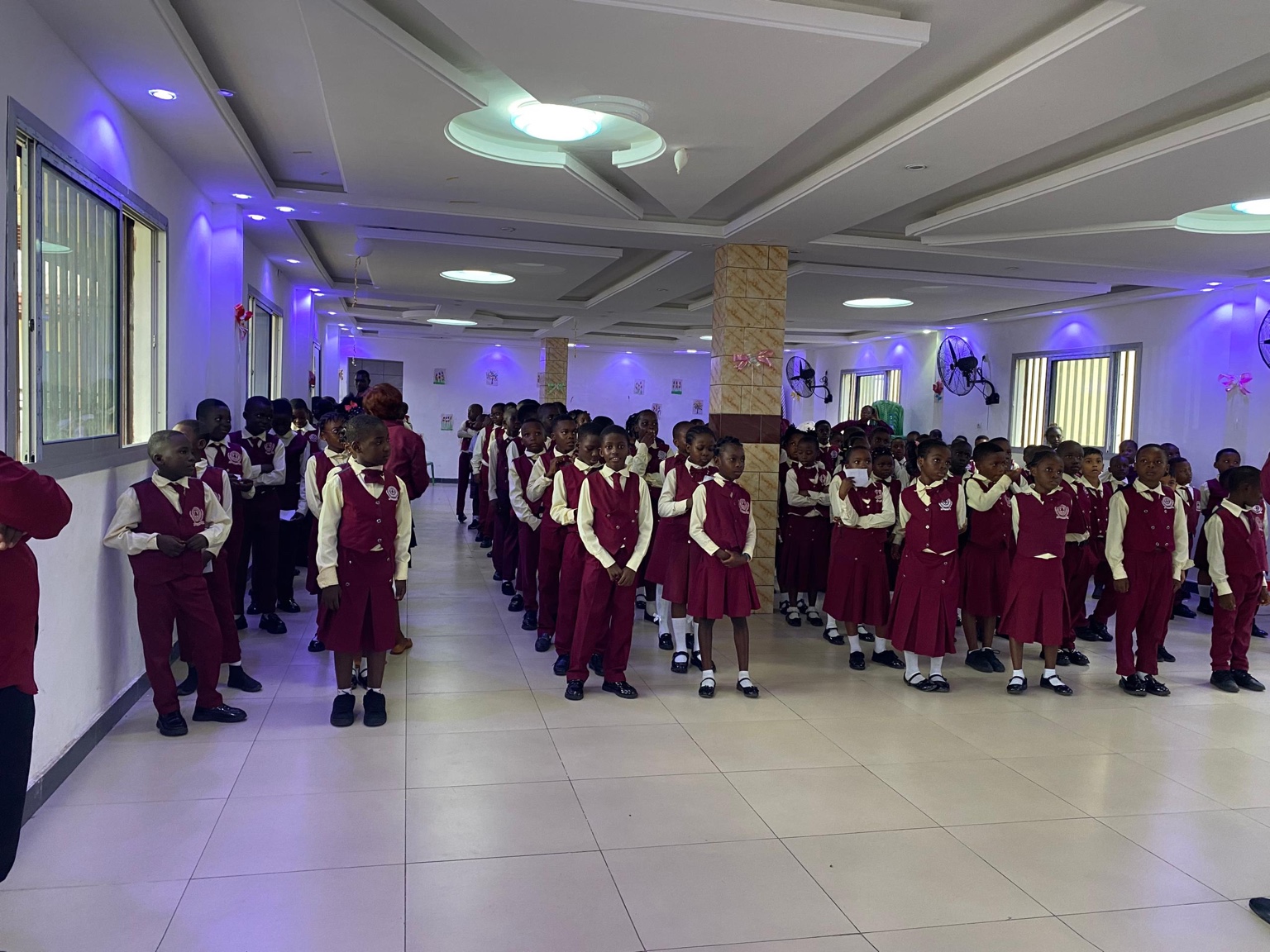 Innovative pupils gathered in rows inside the school hall