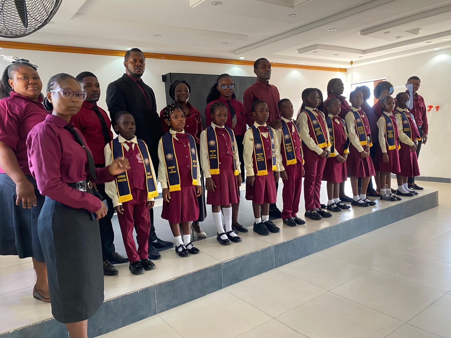 Pupil leaders wearing their official sashes alongside members of the school team