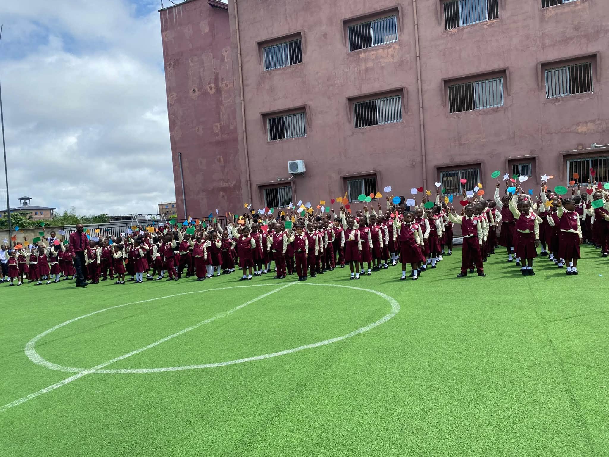 The school community gathered on the sports field