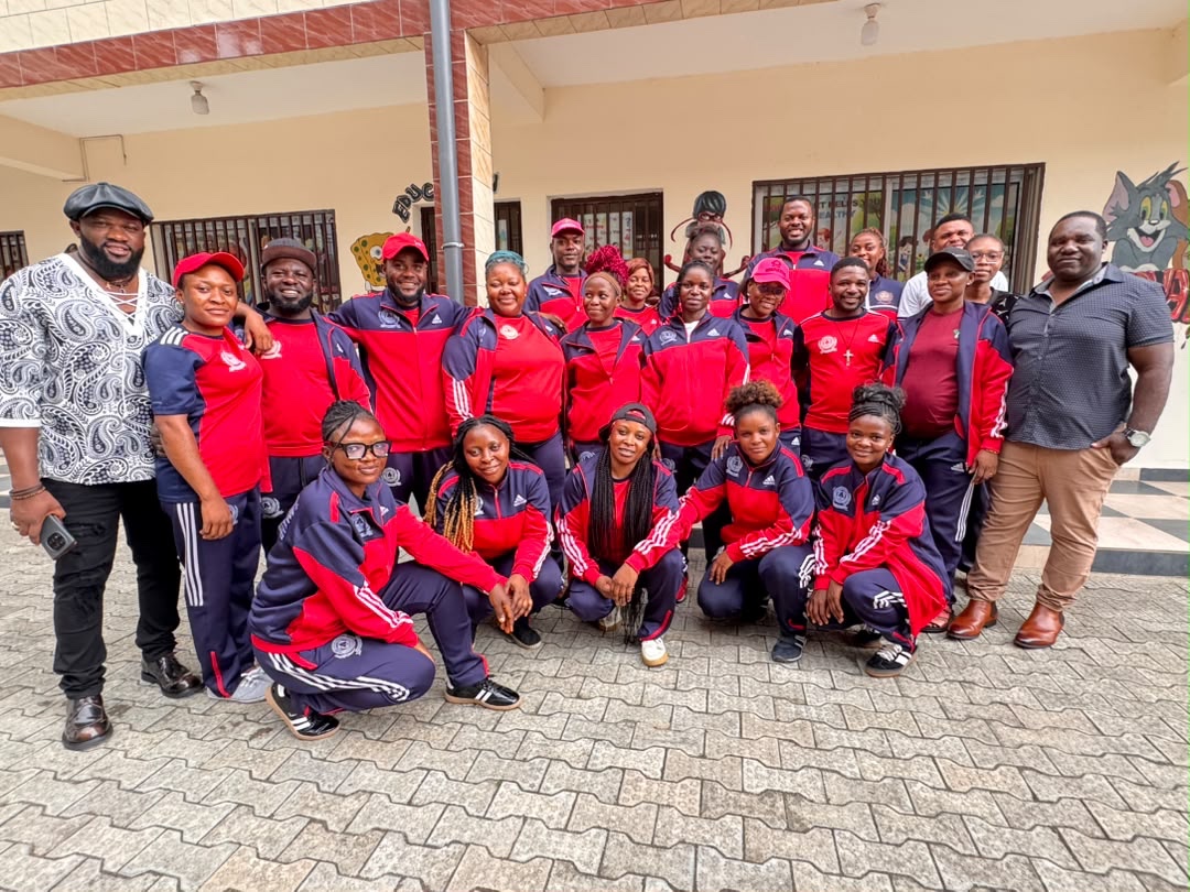 Visitors and Innovative staff posing together outside the school
